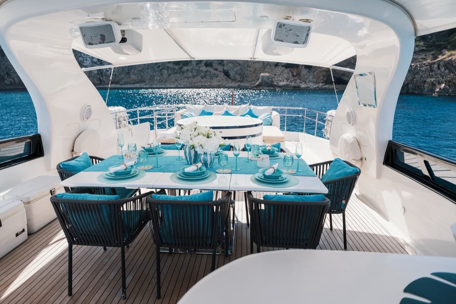 Friends on the bow of a yacht in Formentera